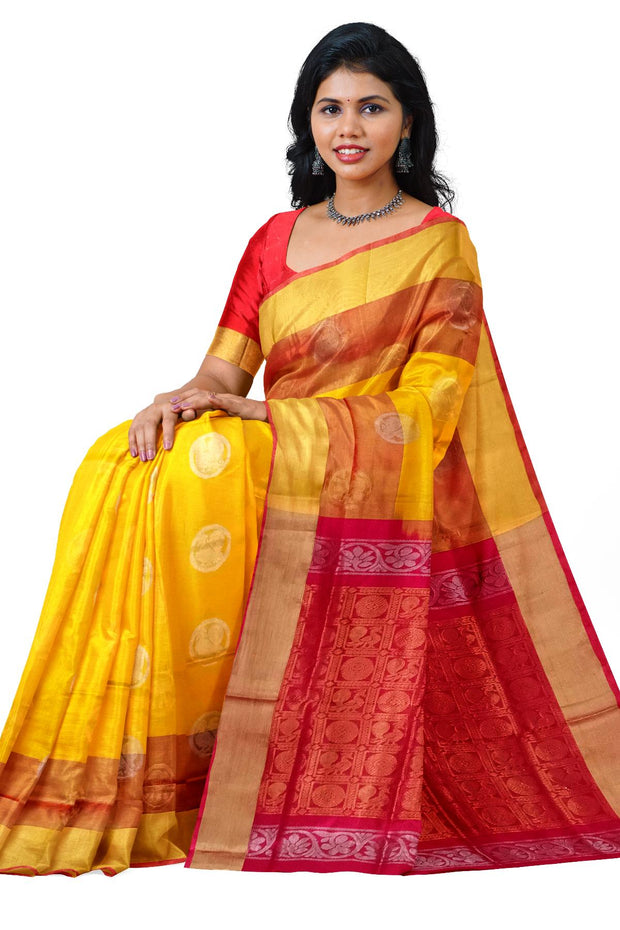 Handwoven Uppada pure silk saree in yellow with gold & silver motifs .