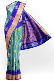 Handwoven Uppada pure silk saree in double shaded  green with gold & silver motifs .