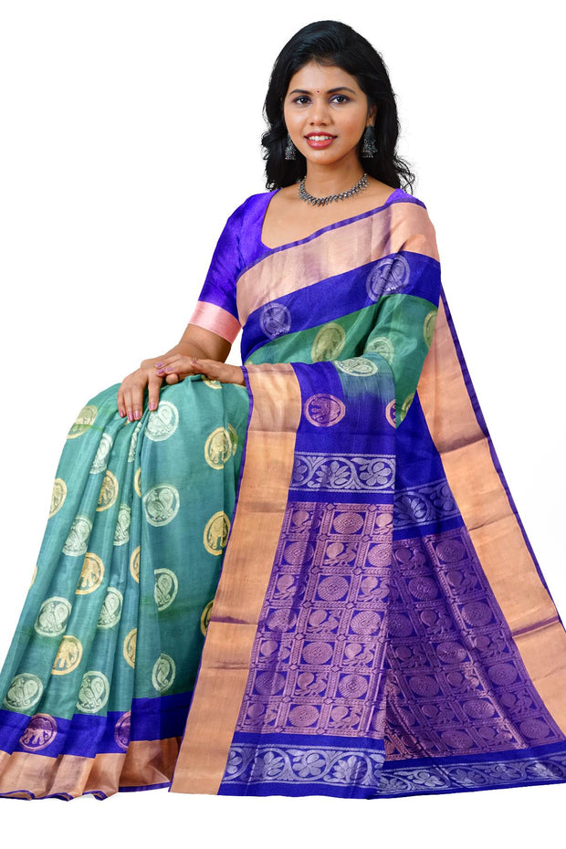 Handwoven Uppada pure silk saree in double shaded  green with gold & silver motifs .