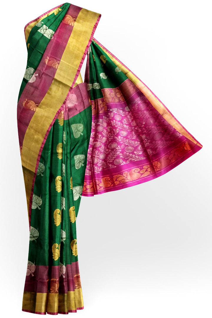 Handwoven Uppada pure silk saree in bottle  green with gold & silver motifs .