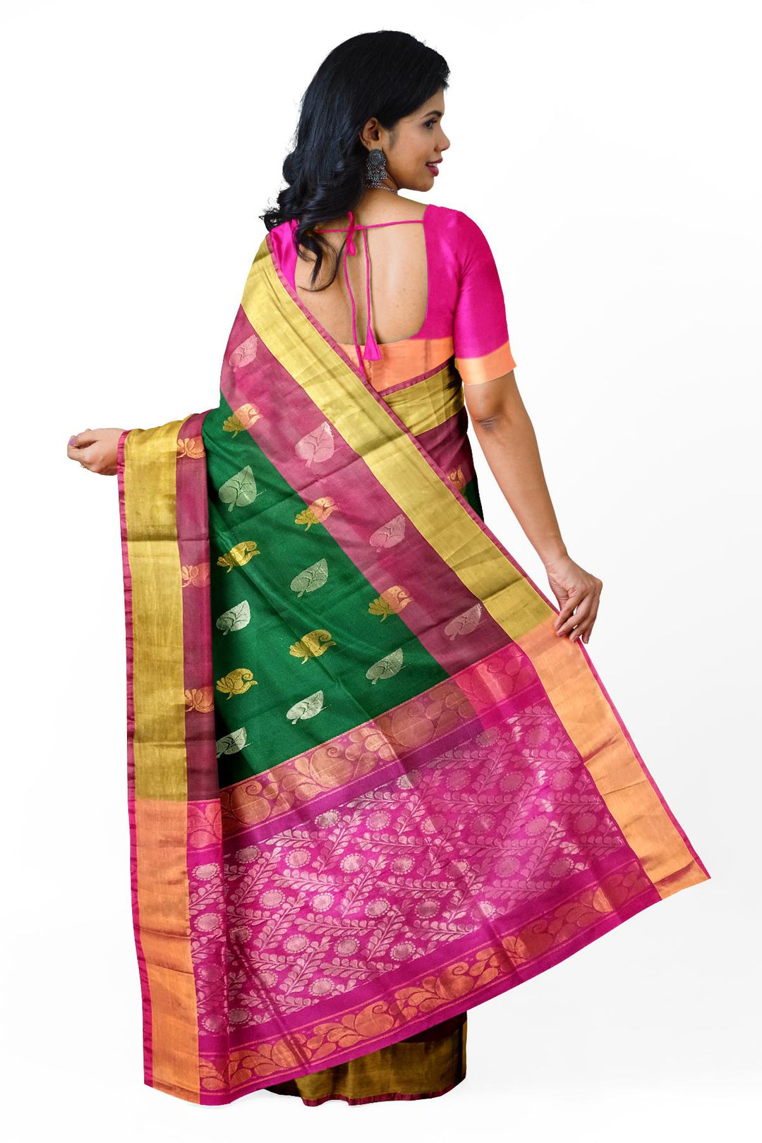 Handwoven Uppada pure silk saree in bottle  green with gold & silver motifs .