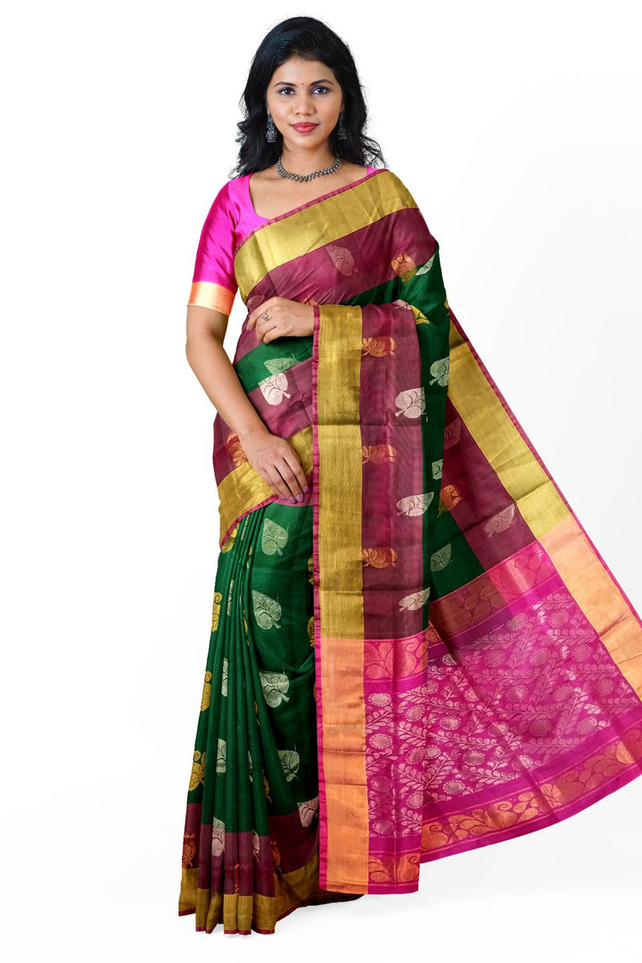 Handwoven Uppada pure silk saree in bottle  green with gold & silver motifs .