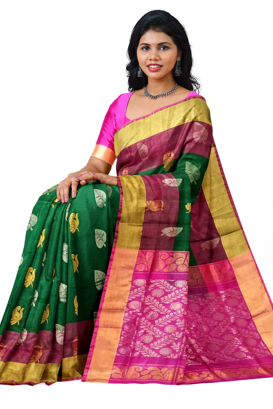Handwoven Uppada pure silk saree in bottle  green with gold & silver motifs .