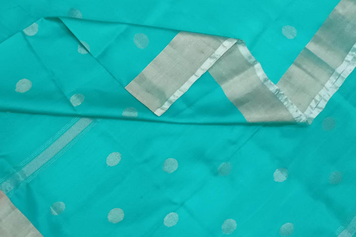 Handwoven Uppada pure silk saree in teal blue with silver motifs