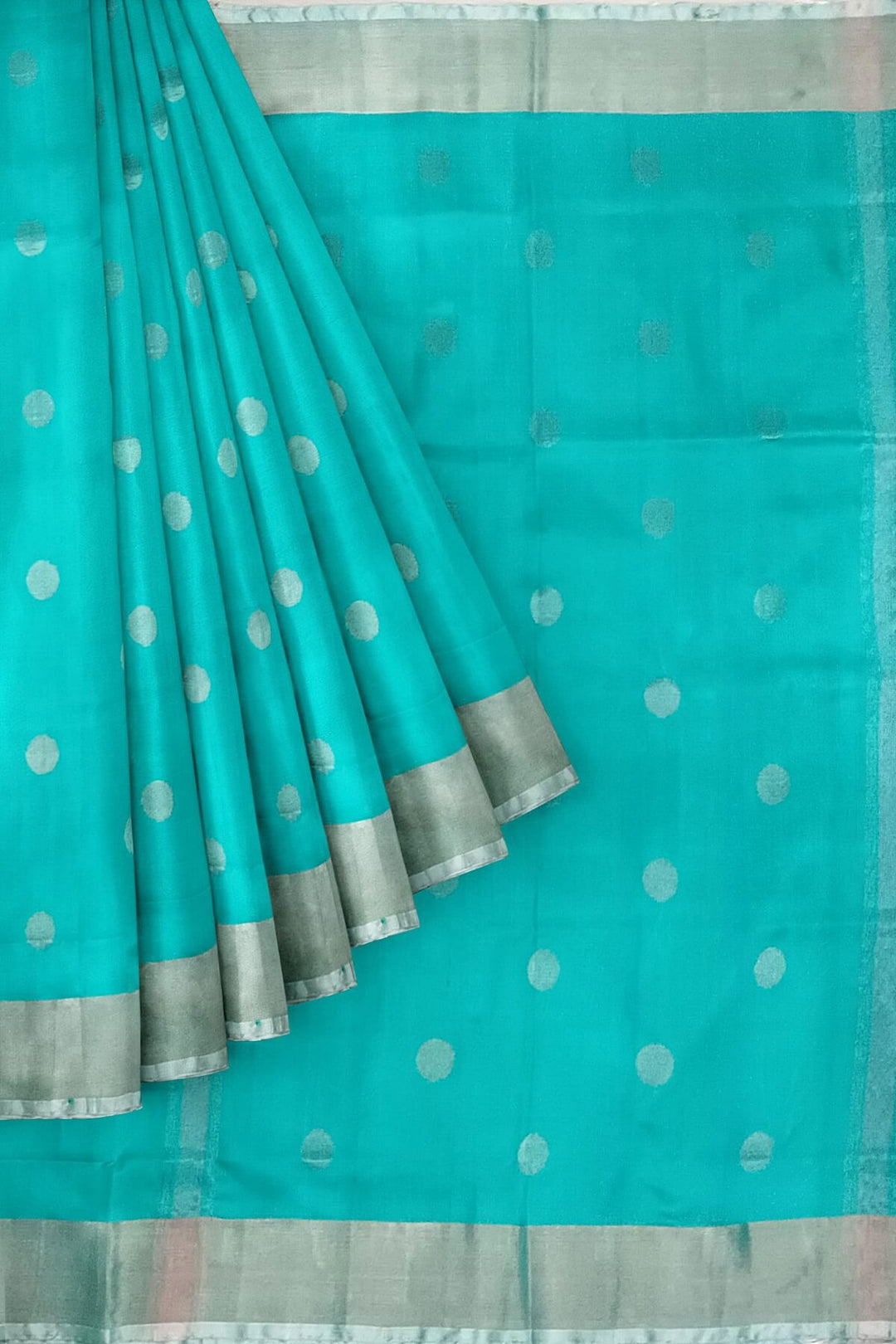Handwoven Uppada pure silk saree in teal blue with silver motifs