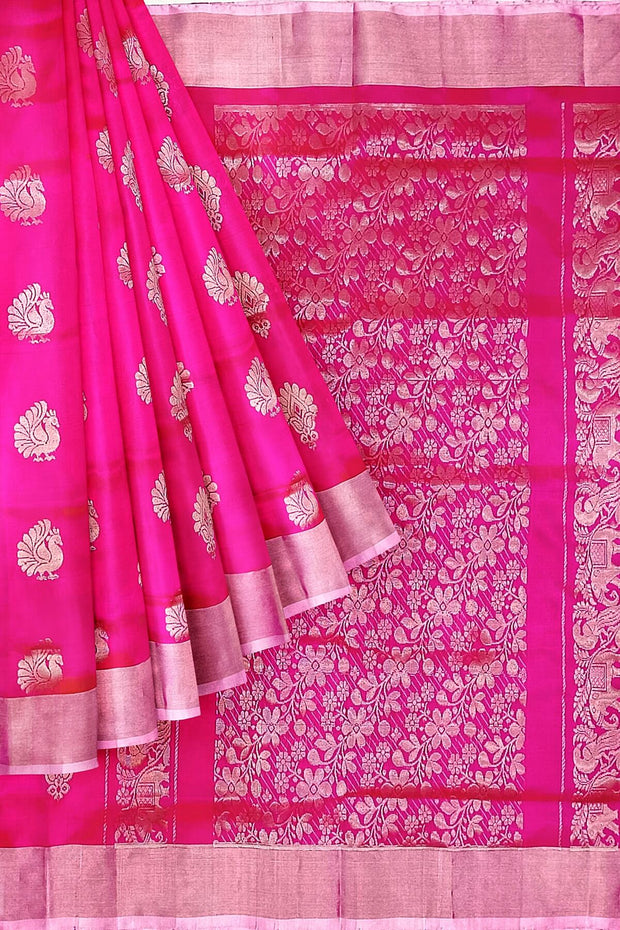 Handwoven Uppada pure silk saree in rani pink with  floral motifs .