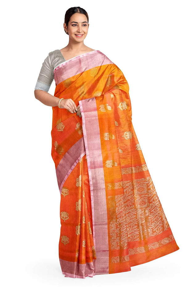 Handwoven Uppada pure silk saree in peach with  floral motifs .