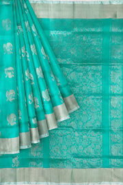 Handwoven Uppada pure silk saree in teal green with  floral motifs .