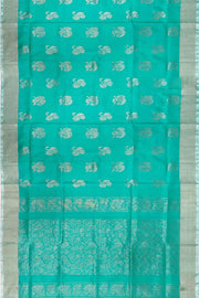 Handwoven Uppada pure silk saree in teal green with  floral motifs .