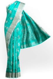 Handwoven Uppada pure silk saree in teal green with  floral motifs .