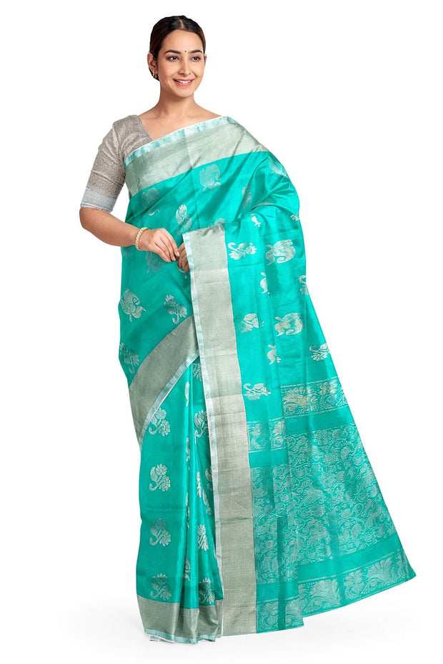 Handwoven Uppada pure silk saree in teal green with  floral motifs .