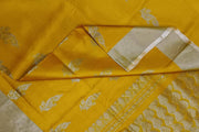 Handwoven Uppada pure silk saree in yellow with floral motifs .