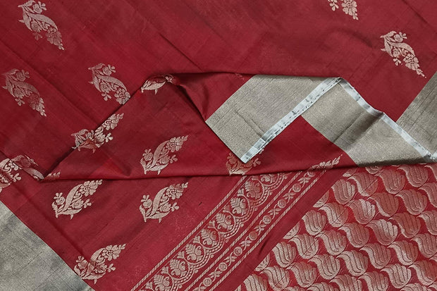 Handwoven Uppada pure silk saree in maroon with floral motifs.