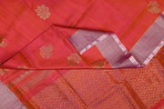 Handwoven Uppada pure silk saree in orangish pink with floral motifs