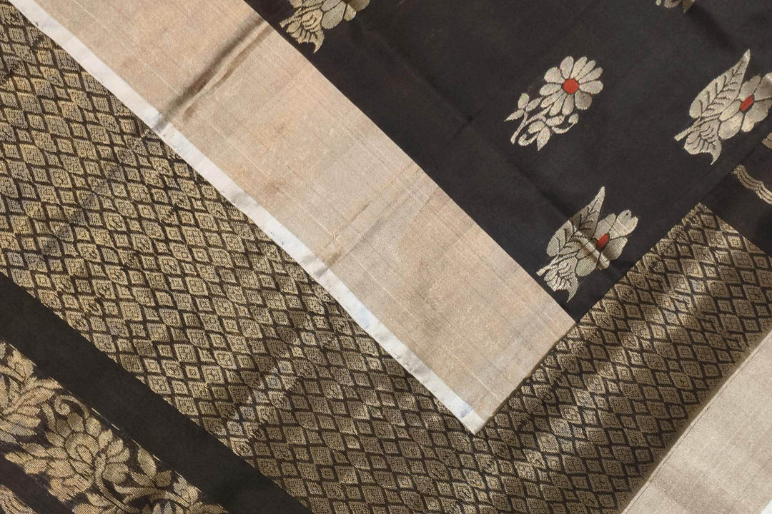 Handwoven Uppada pure silk saree in black with  floral motifs .