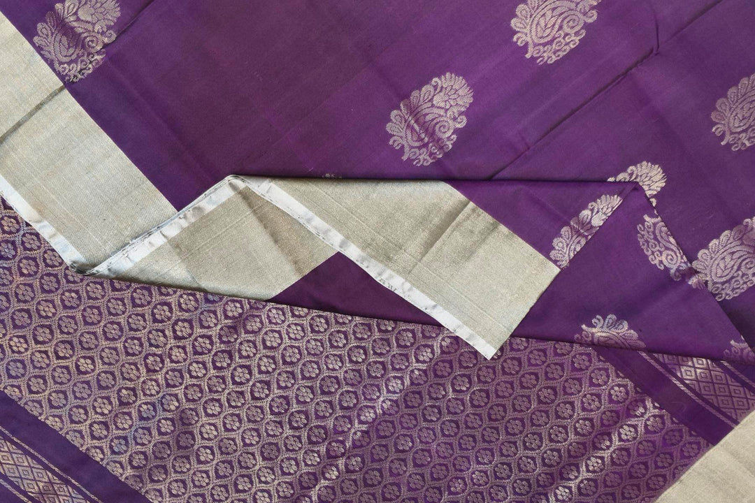Handwoven Uppada pure silk saree in violet with  floral motifs .