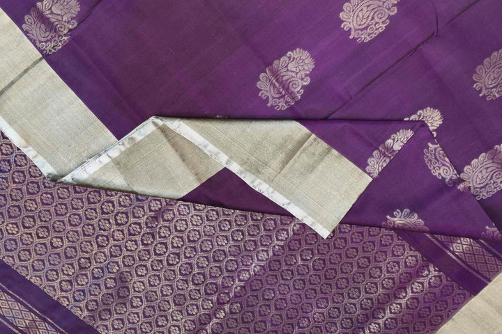 Handwoven Uppada pure silk saree in violet with  floral motifs .