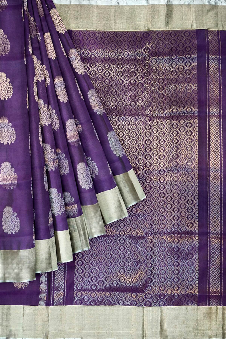 Handwoven Uppada pure silk saree in violet with  floral motifs .