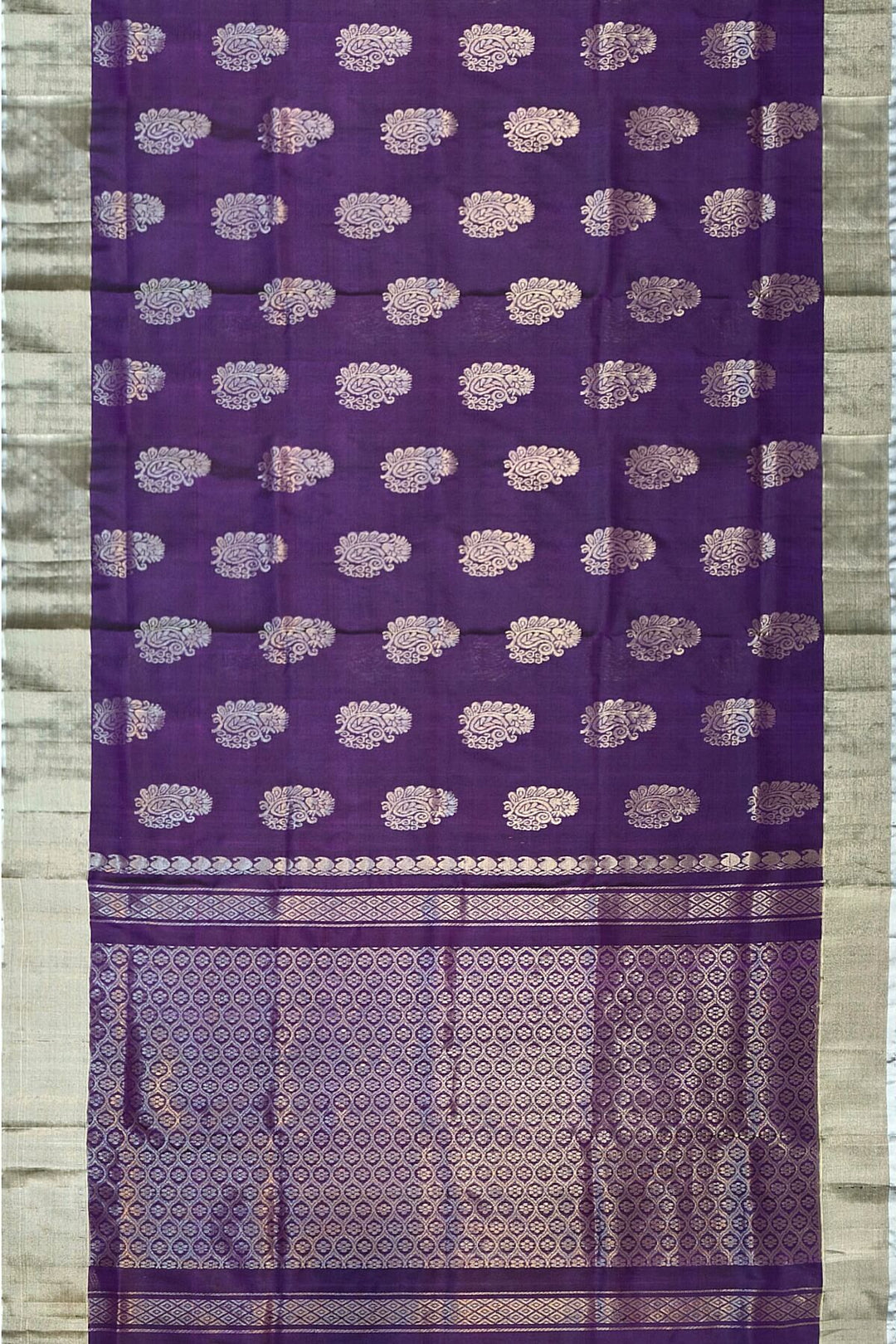 Handwoven Uppada pure silk saree in violet with  floral motifs .