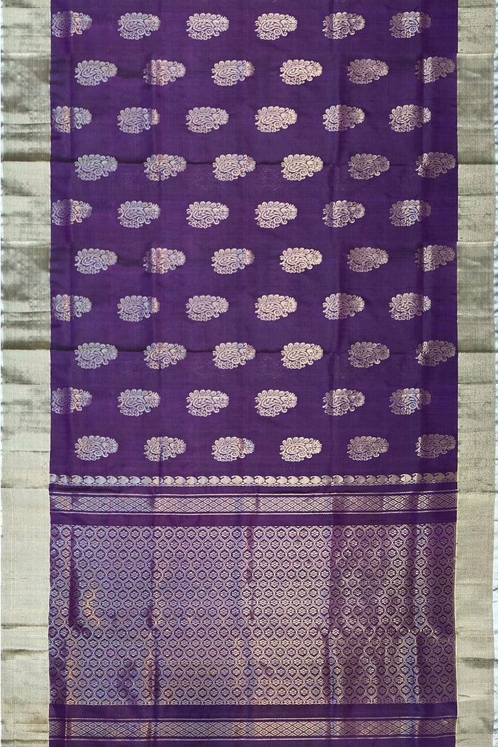Handwoven Uppada pure silk saree in violet with  floral motifs .
