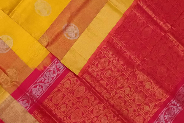 Handwoven Uppada pure silk saree in yellow with gold & silver motifs .