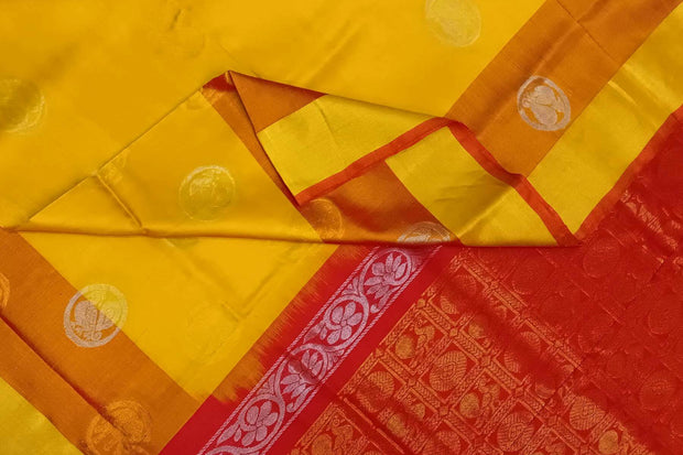 Handwoven Uppada pure silk saree in yellow with gold & silver motifs .