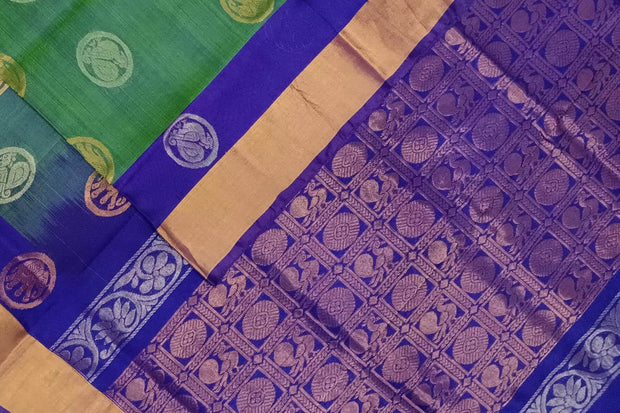 Handwoven Uppada pure silk saree in double shaded  green with gold & silver motifs .