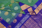 Handwoven Uppada pure silk saree in double shaded  green with gold & silver motifs .