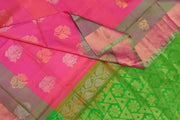 Handwoven Uppada pure silk saree in reddish pink with gold & silver motifs .