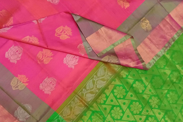 Handwoven Uppada pure silk saree in reddish pink with gold & silver motifs .