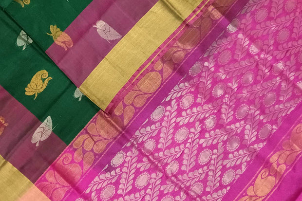 Handwoven Uppada pure silk saree in bottle  green with gold & silver motifs .