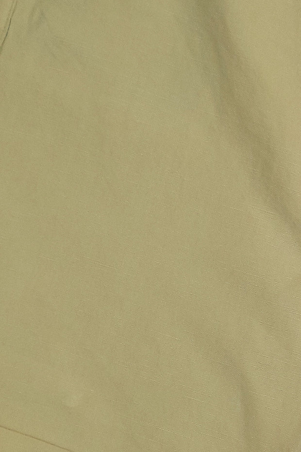 Solid linen shorts with stretchable waist and pockets in beige