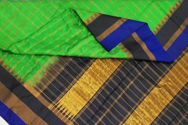Handwoven Gadwal pure silk saree  in green in checks pattern
