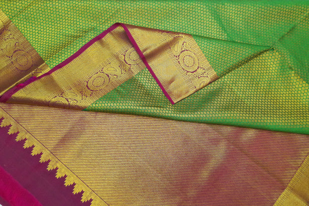 Handwoven Kanchi pure silk brocade saree in leaf green with pallu in pink