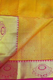 Kanchi silk brocade saree in yellow with contrast pallu in pink
