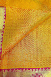 Kanchi silk brocade saree in yellow with contrast pallu in pink