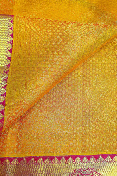 Kanchi silk brocade saree in yellow with contrast pallu in pink