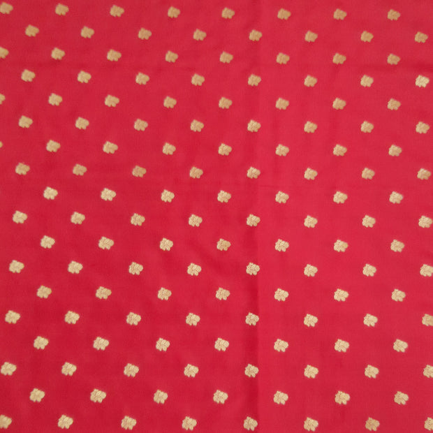 Pure silk fabric in red with small motifs in gold