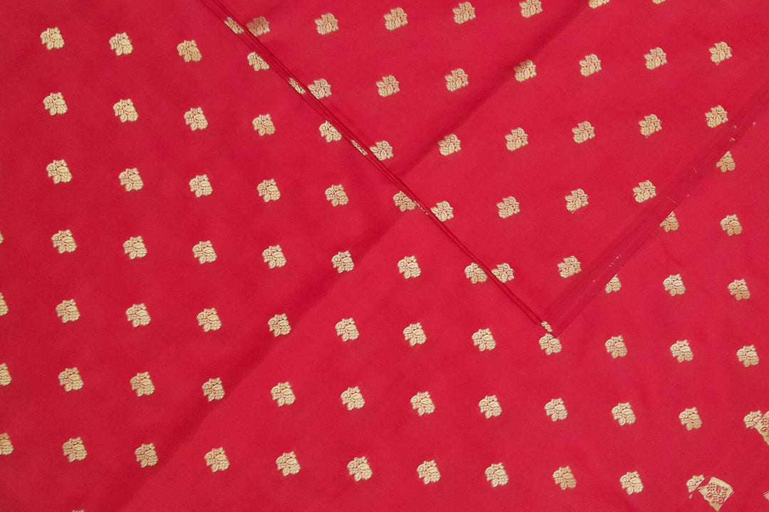 Pure silk fabric in red with small motifs in gold