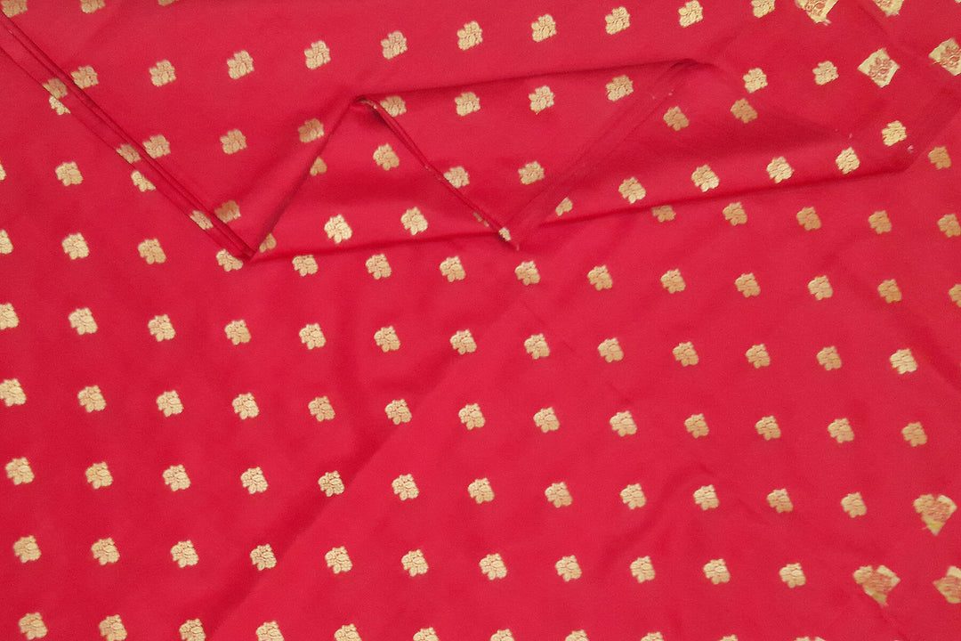 Pure silk fabric in red with small motifs in gold
