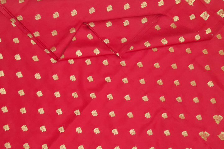 Pure silk fabric in red with small motifs in gold