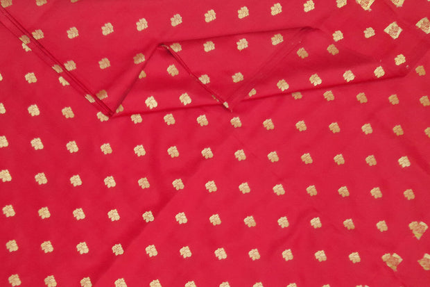 Pure silk fabric in red with small motifs in gold