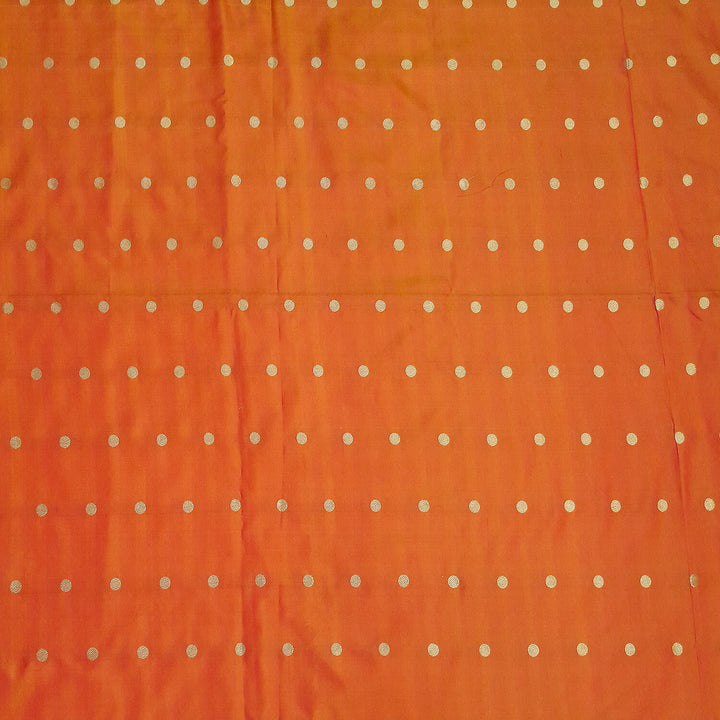 Pure silk fabric in double shaded honey colour with small motifs in gold