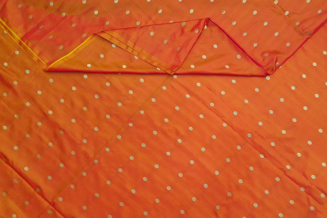 Pure silk fabric in double shaded honey colour with small motifs in gold