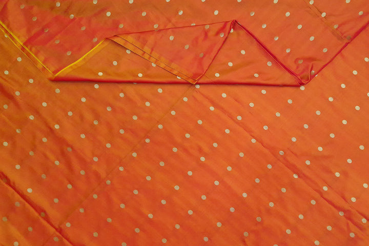 Pure silk fabric in double shaded honey colour with small motifs in gold