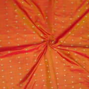 Pure silk fabric in double shaded honey colour with small motifs in gold