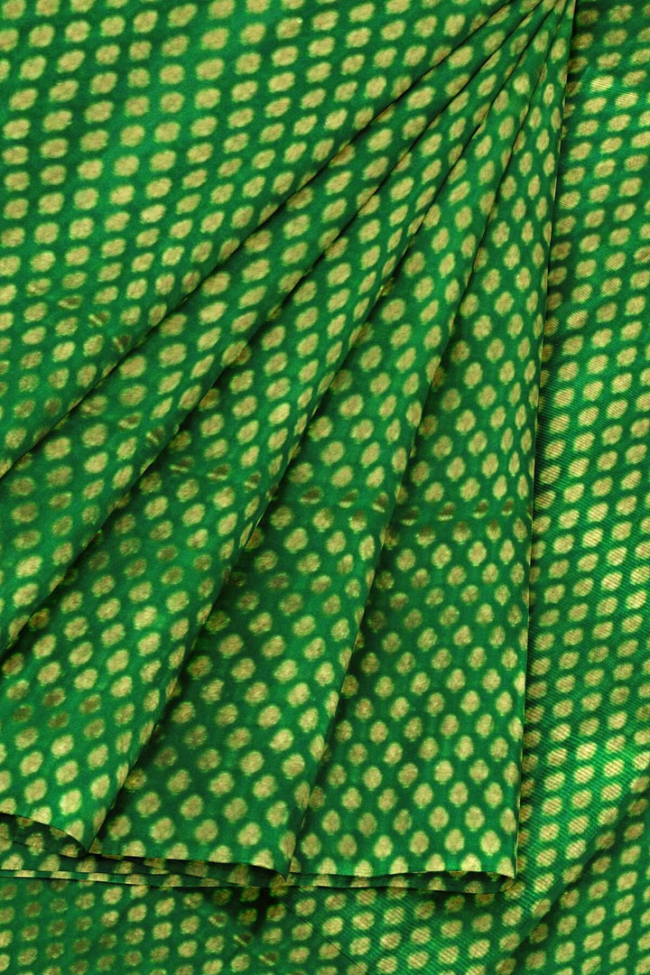 Banarasi  silk fabric in green  . Available in multiples of 1M & 2.5M