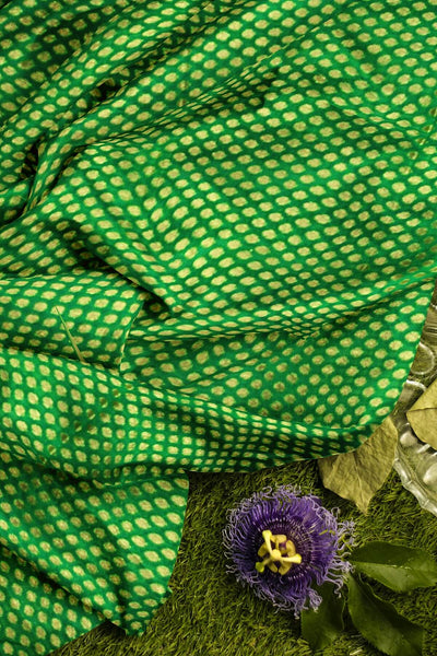 Banarasi  silk fabric in green  . Available in multiples of 1M & 2.5M