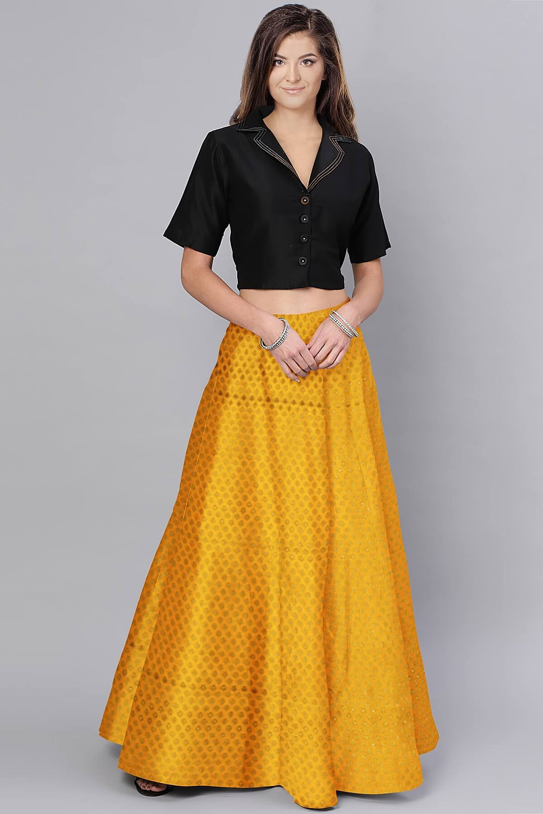 Banarasi  silk fabric in saffron yellow . Available in multiples of 1M & 2.5M