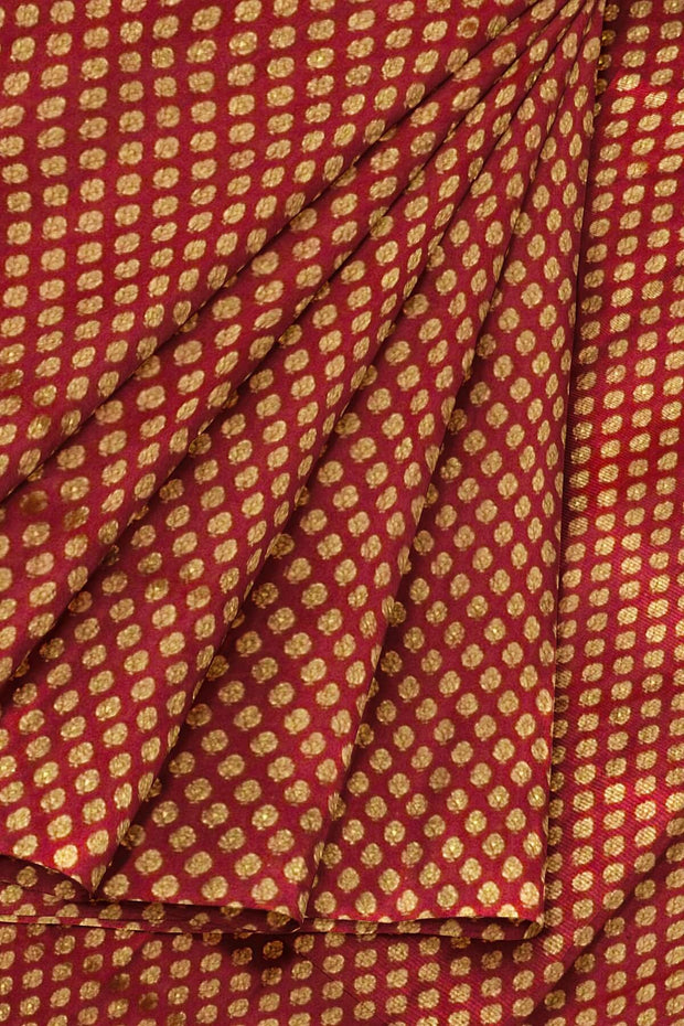 Banarasi  silk fabric in maroon . Available in multiples of 1M & 2.5M